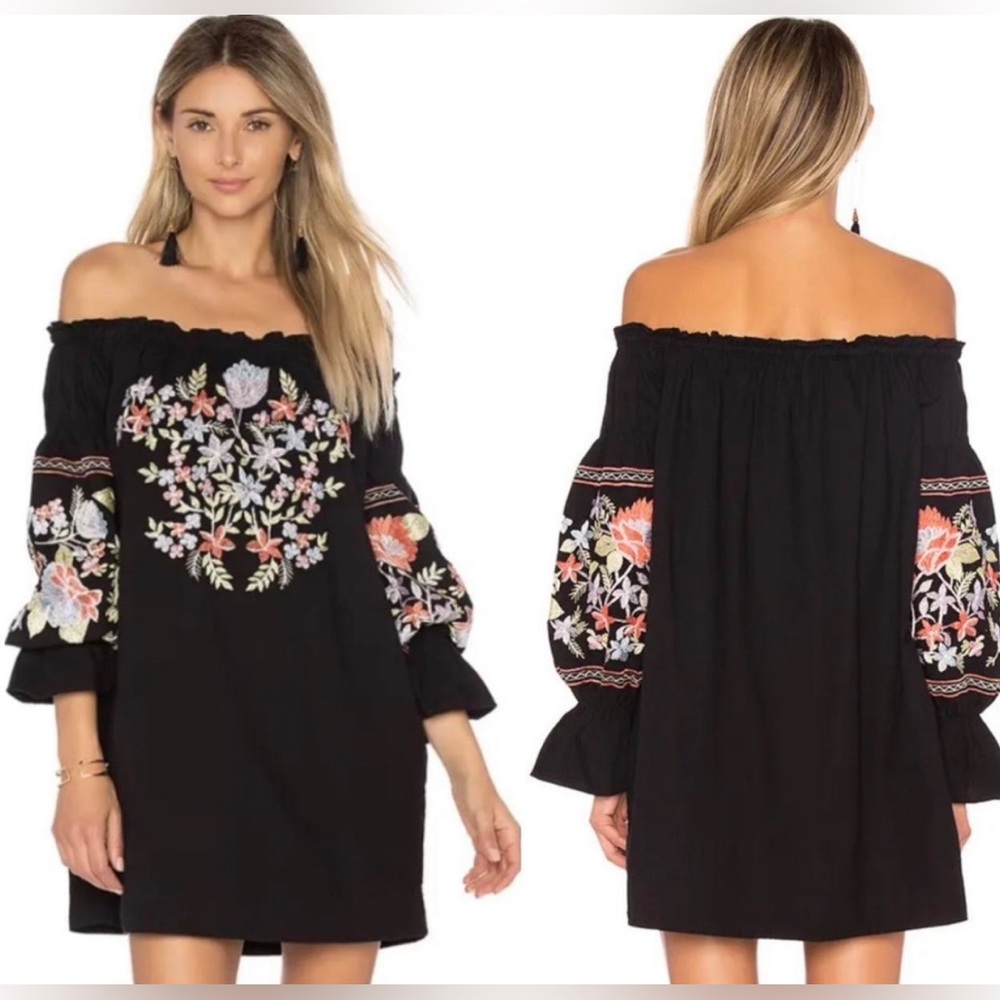 Free People black dress with embroidery.